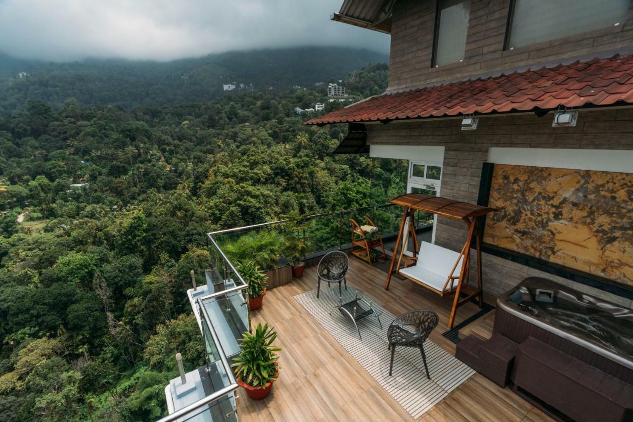 The Panoramic Getaway Hotel Munnar Exterior foto A view from the balcony of a house in Kerala, India